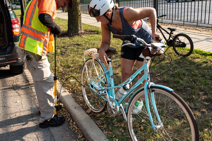 pumping up a bike tire